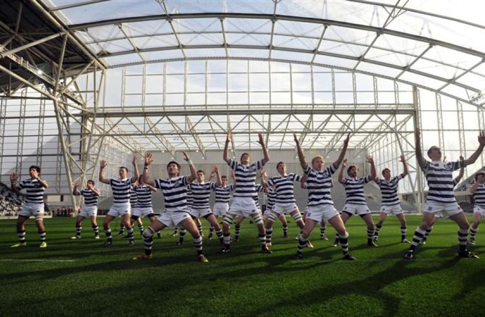 Knox college players perform a haka prior to their game against Selwyn College. Photo by Craig...