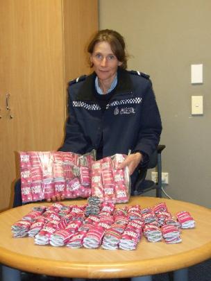 Senior Constable Beth Fookes displays the  Kush Pink seized by police. Photo by Christina McDonald.