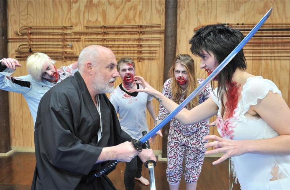 Sensei Phil Davison battles zombies Sarah Williamson (foreground) and (from left) Charlotte...