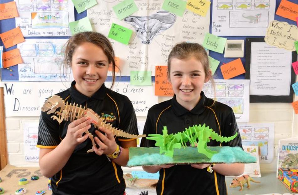Shakirah Stephen (left, 10) and Syd O'Leary (10) with their dinosaur models. Photos by Linda...