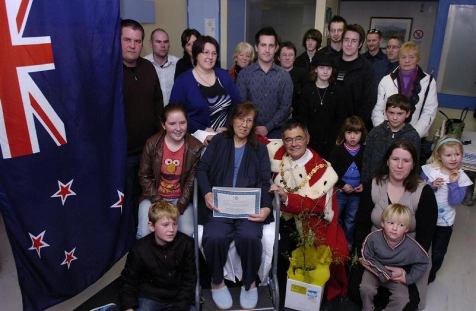 Sharon Davies (centre) with Dunedin Mayor David Cull and her family after a special New Zealand...