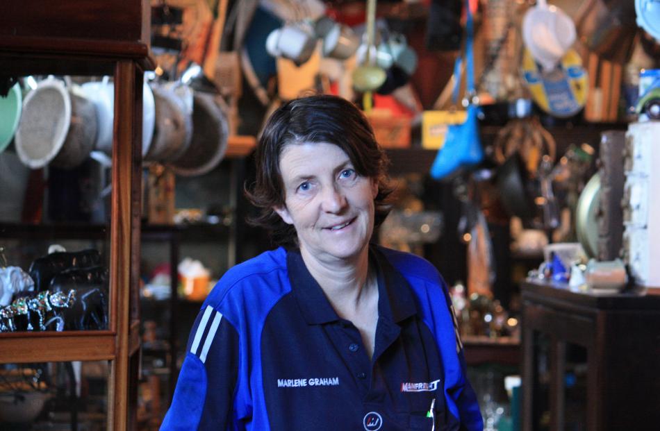 Shingle Creek Collectables owner Marlene Graham is surrounded by all manner of things in her...
