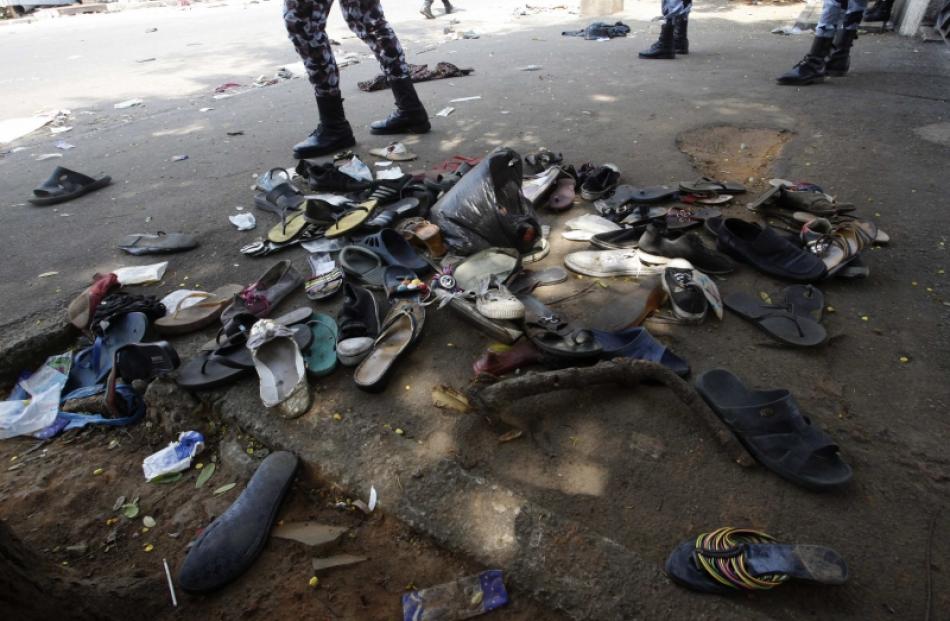 Shoes are seen along a street in Plateau district where a stampede occurred after a New Year's...