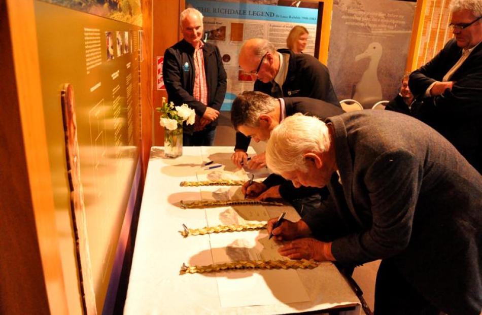 Signing the Pukekura reserves management plan at a special event at Taiaroa Head yesterday are ...