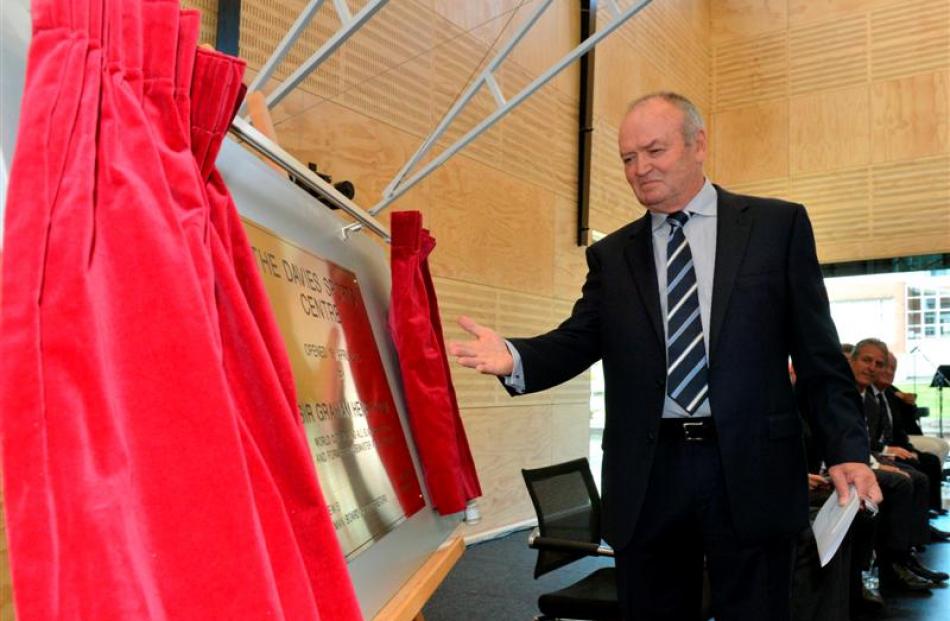 Sir Graham Henry unveils the foundation plaque;  the new $4 million centre.