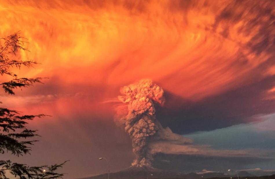 Smoke and ash rise from the Calbuco volcano as seen from the city of Puerto Montt. Photo: REUTERS...