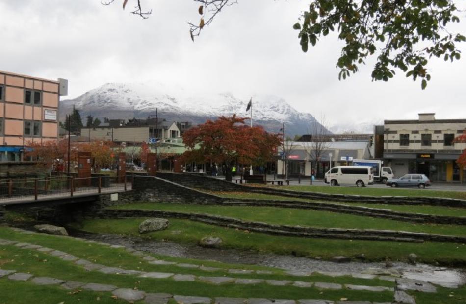 Snow on the hills is making for a cool day in Queenstown today. Photo James Beech