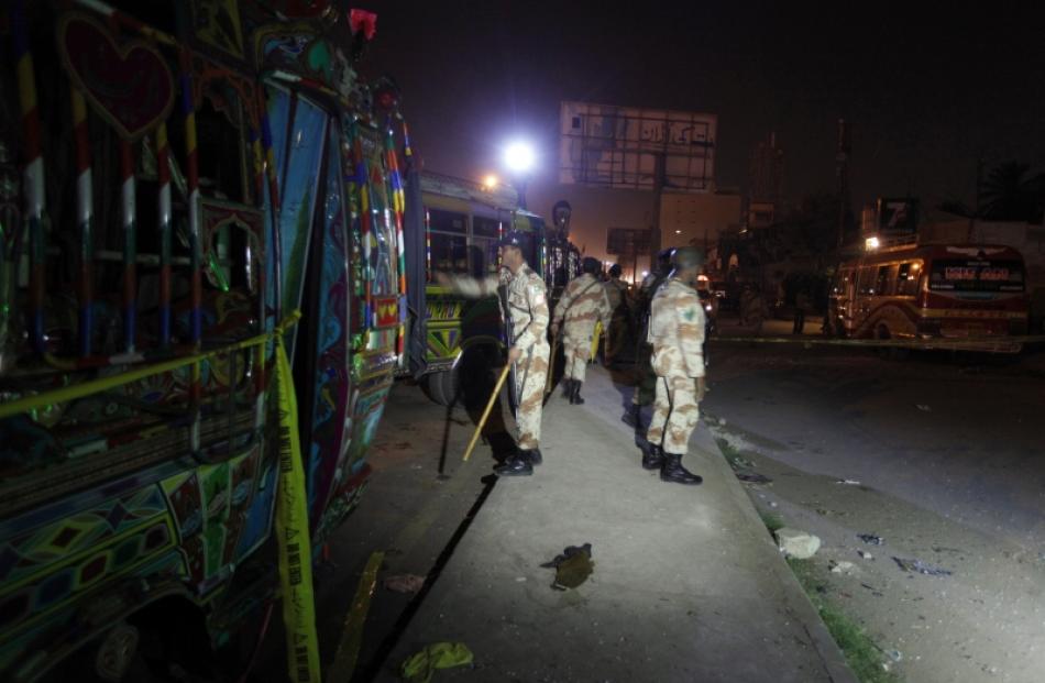 Soldiers cordon off the site of a motorcycle bomb blast in Karachi. Photo by Reuters