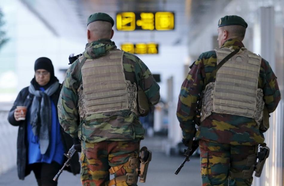 Soldiers patrol at Zaventem international airport near Brussels after security was tightened in...