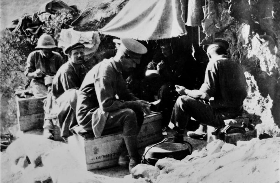 Soldiers relax at meal time.