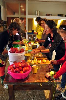 Some of the volunteers working hard in the Rippon Hall kitchen. Photo from Local Food Wanaka.