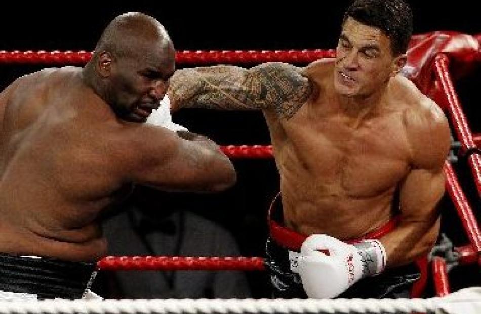 Sonny Bill Williams lands a punch on Clarence Tillman at Claudelands Event Centre in Hamilton...