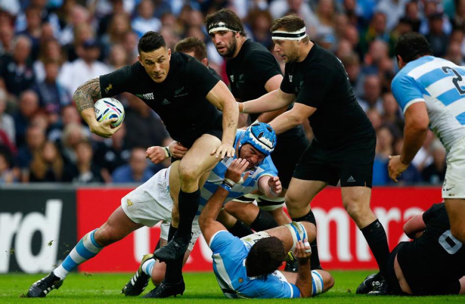 Sonny Bill Williams looks to offload in the tackle. Photo: Getty Images.