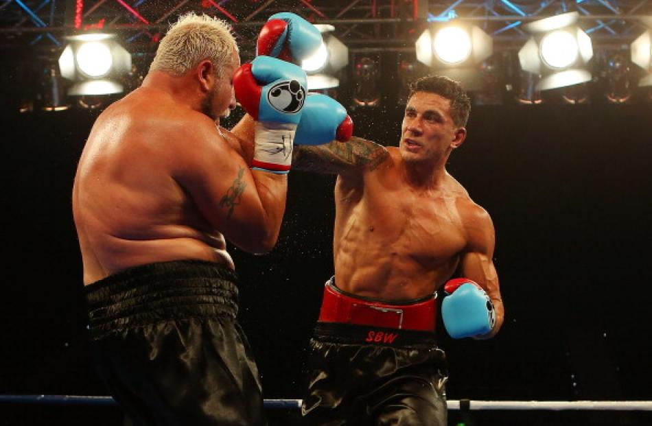 Sonny Bill Williams punches Francois Botha during their recent fight in Brisbane. Photo by Getty