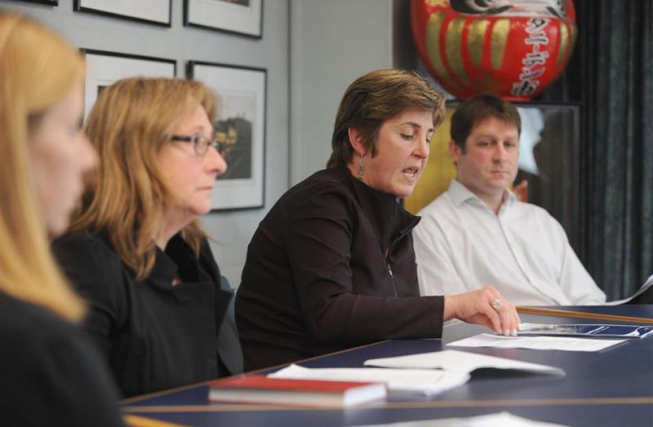 South Dunedin Business Association president Jane Orbell (second from left) listens as Dunedin...