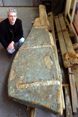 South Otago Museum curator Gary Ross with a rudder which may be related to an old anchor which...