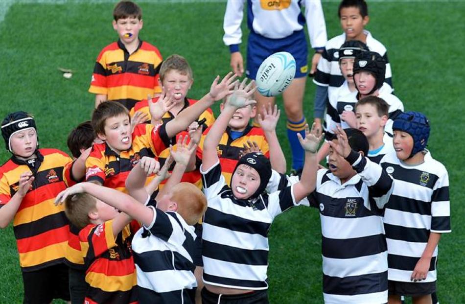 Southern and Zingari-Richmond under-11 players fight for the ball in a lineout at Forsyth Barr...