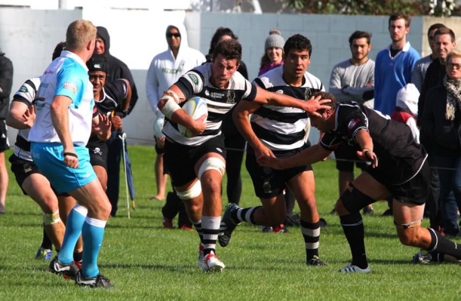 Southern flanker Adam Knight makes a determined run towards
...