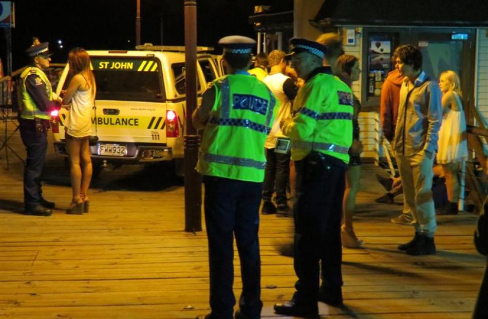 Southern police had to carve a path through the throng of people for St John ambulance officers...