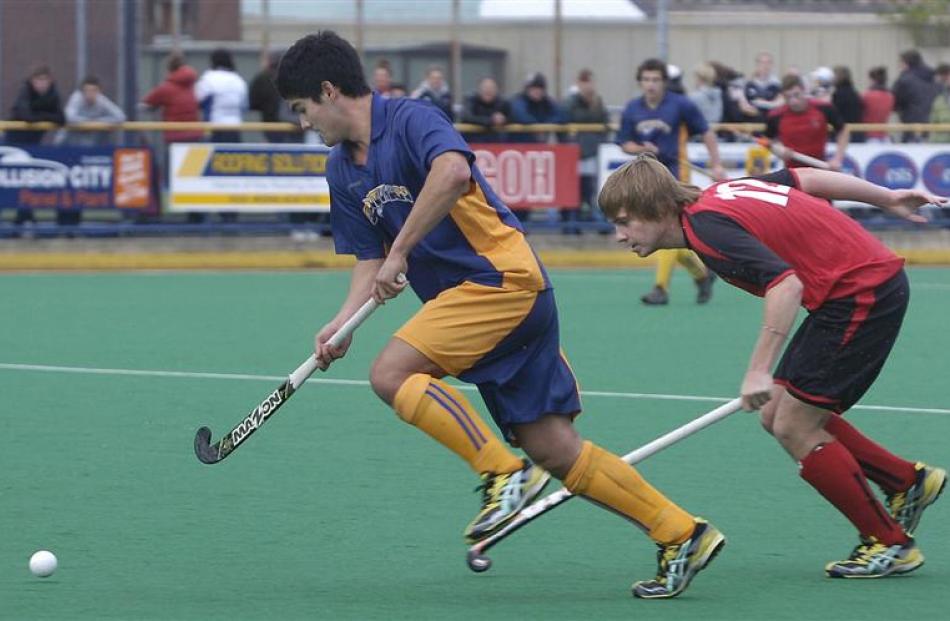 Southern's Tom Clarkson evades Canterbury's Ryan Cocking during a national under-21 tournament...