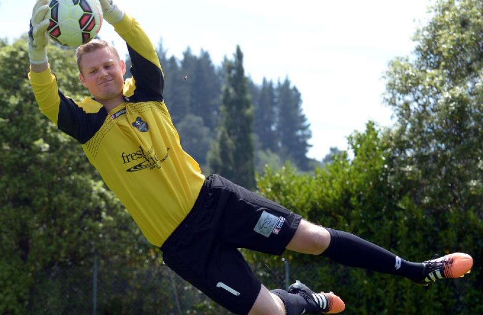 Southern United goalkeeper Tom Batty practises at the Caledonian Ground yesterday. Photo by...