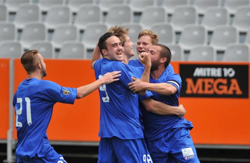 Southern United players celebrate after Andrew Ridden's goal. Photos by Gregor Richardson.