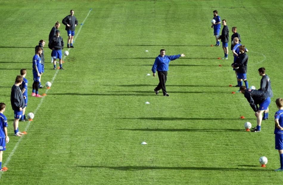 Southern United players train  at Tahuna Park on Thursday night for their first game of the...