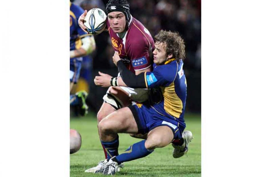 Otago's Sam Hibbard tackles Southland's Hua Tamariki.