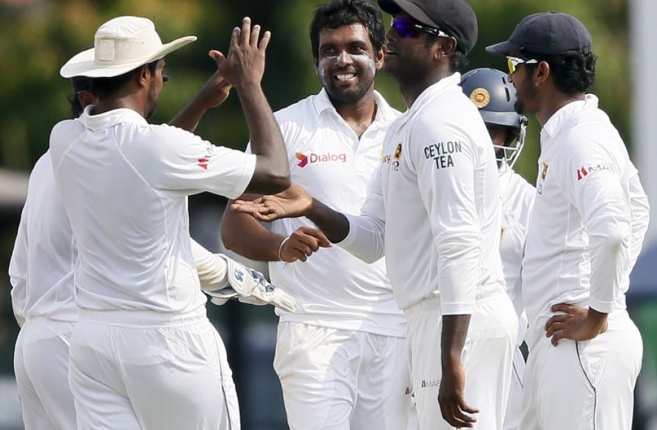 Sri Lanka players celebrate after taking a wicket against the West Indies earlier this year....