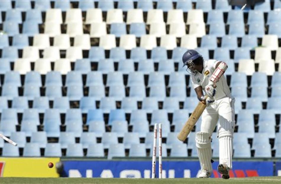 Sri Lanka's Dilhara Fernando is bowled by South Africa's Dale Steyn for a duck during the first...