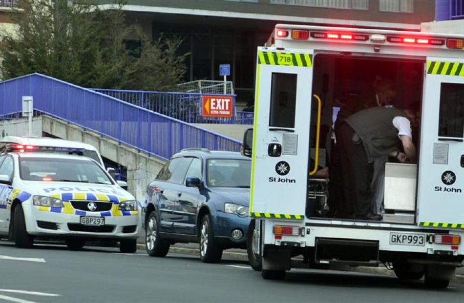 St John ambulance staff treat a 19-year-old skateboarder who crashed into a truck on Broadway....