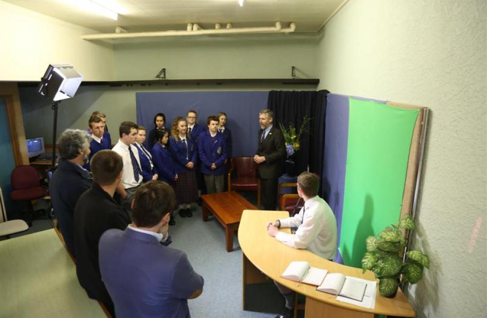 St Kevin's College pupils are shown around the 45 South Television station by college principal...