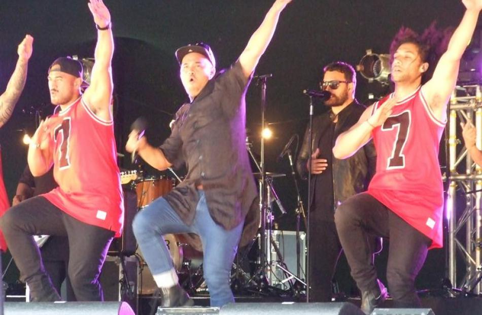 Stan Walker is flanked by dancers as he delivers a high-energy performance. Photos by Christina...