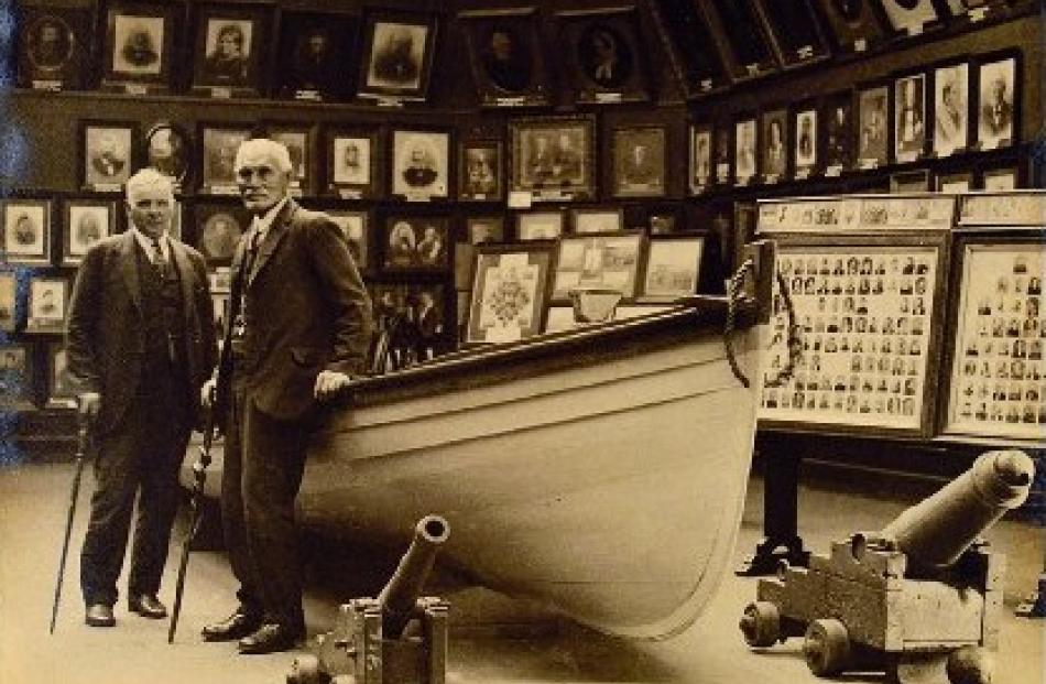 Standing beside the whaleboat Maori Girl  in 1933 are James ‘‘Tiemi’’ Apes (right), an original...