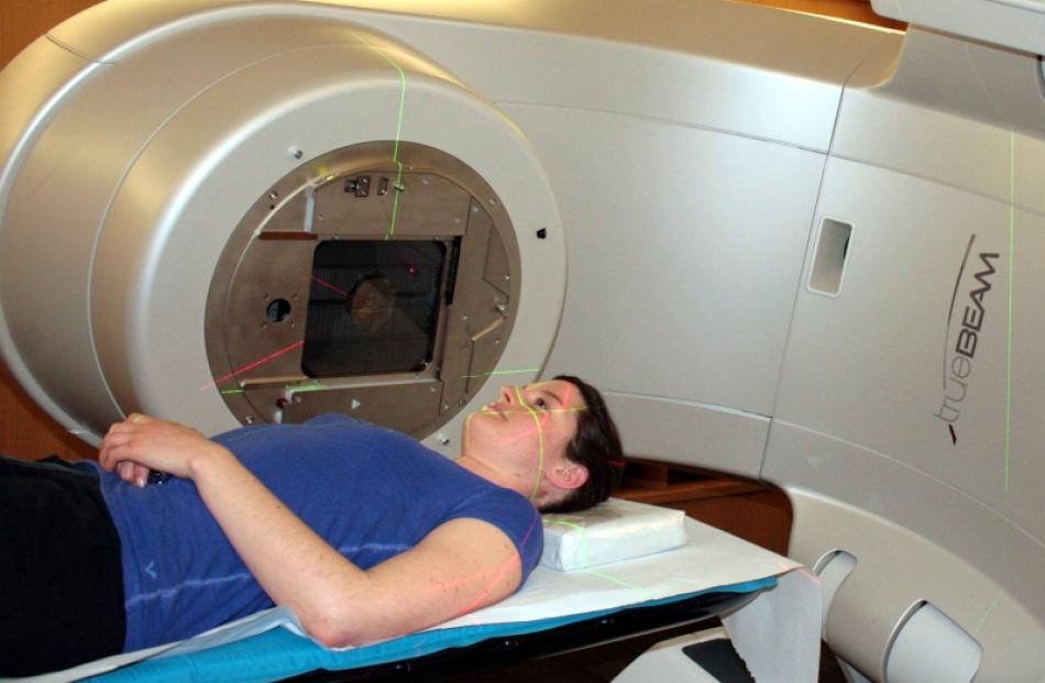 Radiation therapist Maryann Panizza tries out the comfort levels of the new Varian Truebeam...