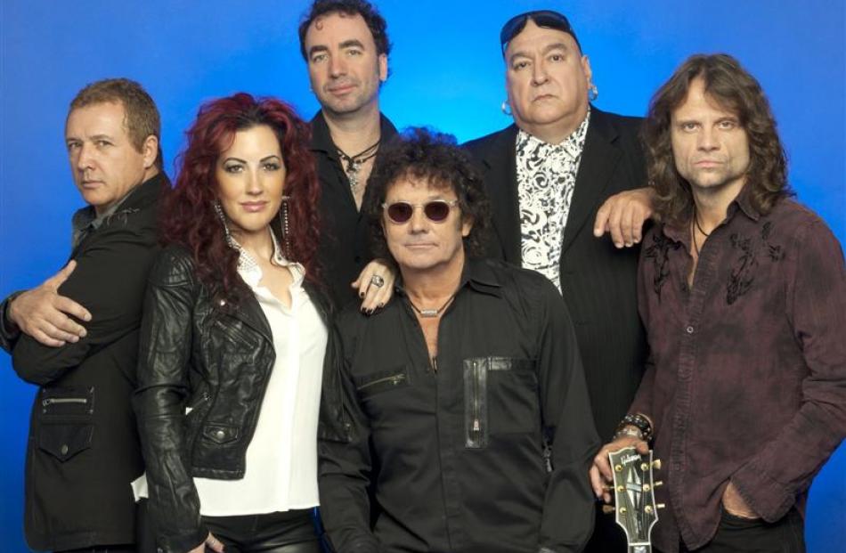 Starship, featuring Mickey Thomas (front centre) with (from left) backing singer and bass player...