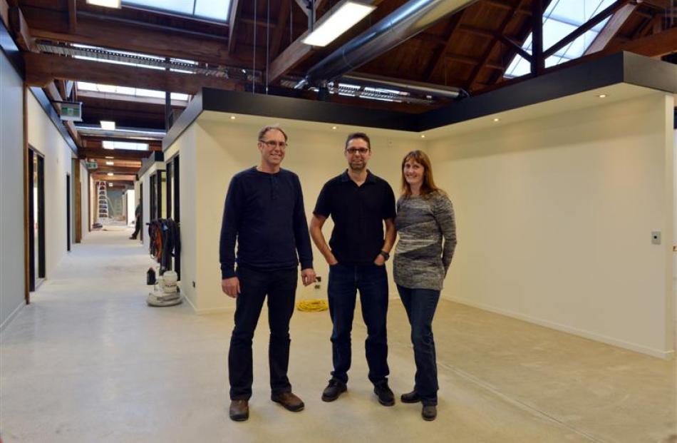 Stephen (left), Michael and Kelly MacKnight in the newly renovated Donald Reid warehouse this week.