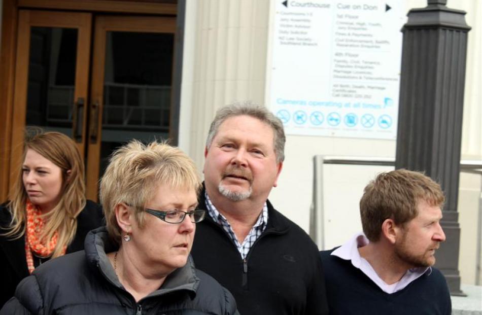 Stephen Long (second from right) leaves the Invercargill District Court yesterday with supporters...