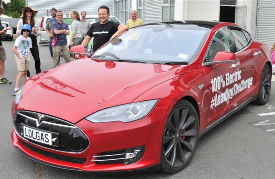 Steve West shows off his top-of-the-line Tesla Model S electric car in Dunedin yesterday. Photo...