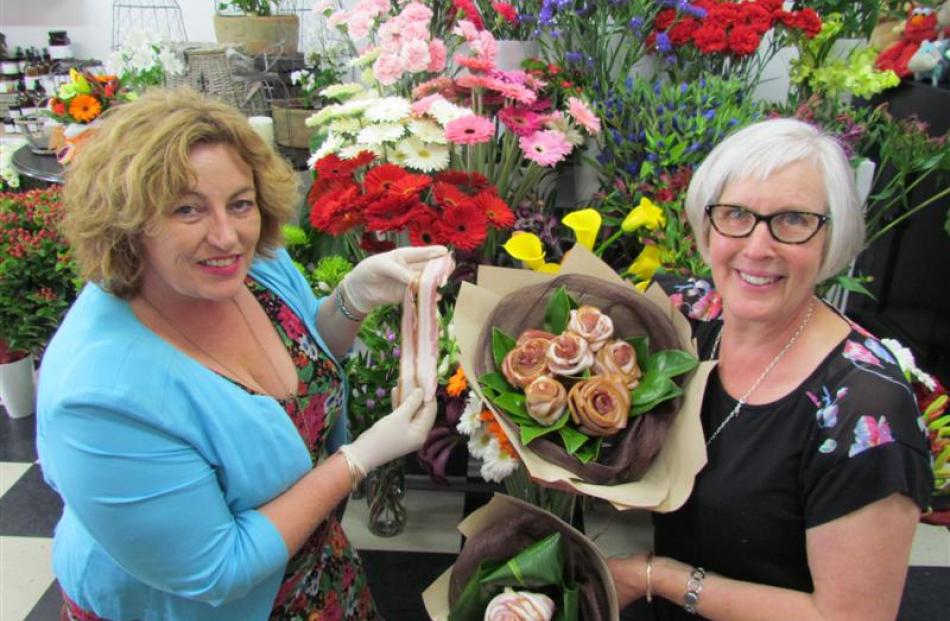 Streaky bacon from Waitaki Bacon and Ham's Sue Morton (left) is made into bouquets and single...