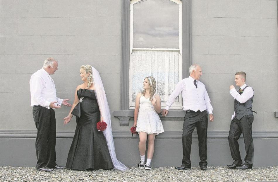 Stuart Ellwood and Angela Walton with their attendants at their Outram wedding in February.
...