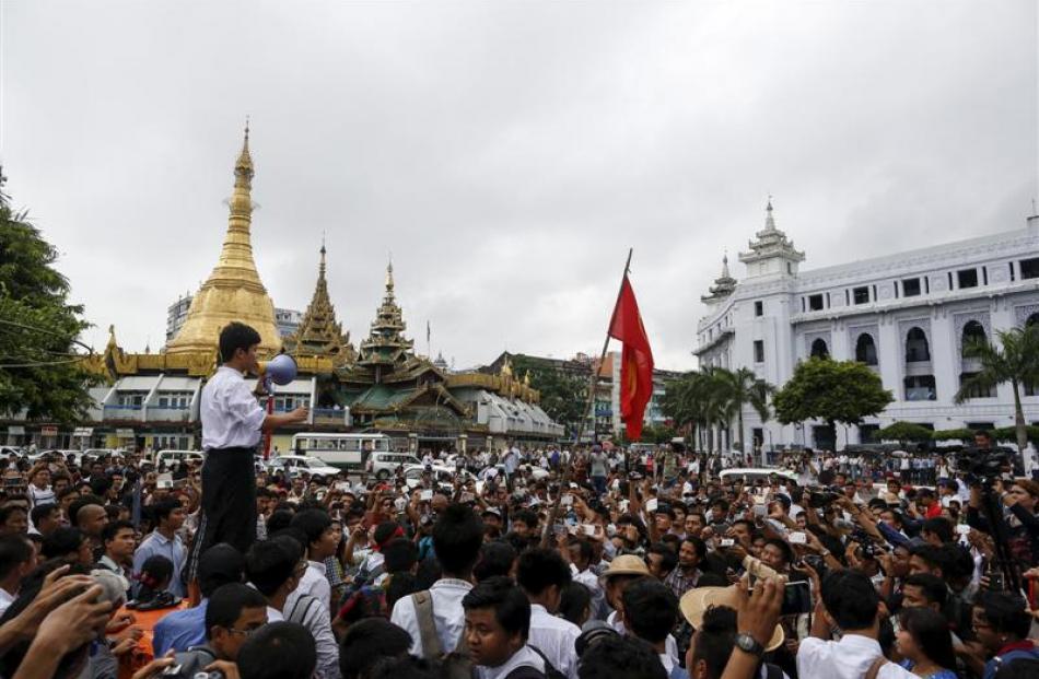 Student leader Nan Lin speaks during a protest against military representatives in Burma's...