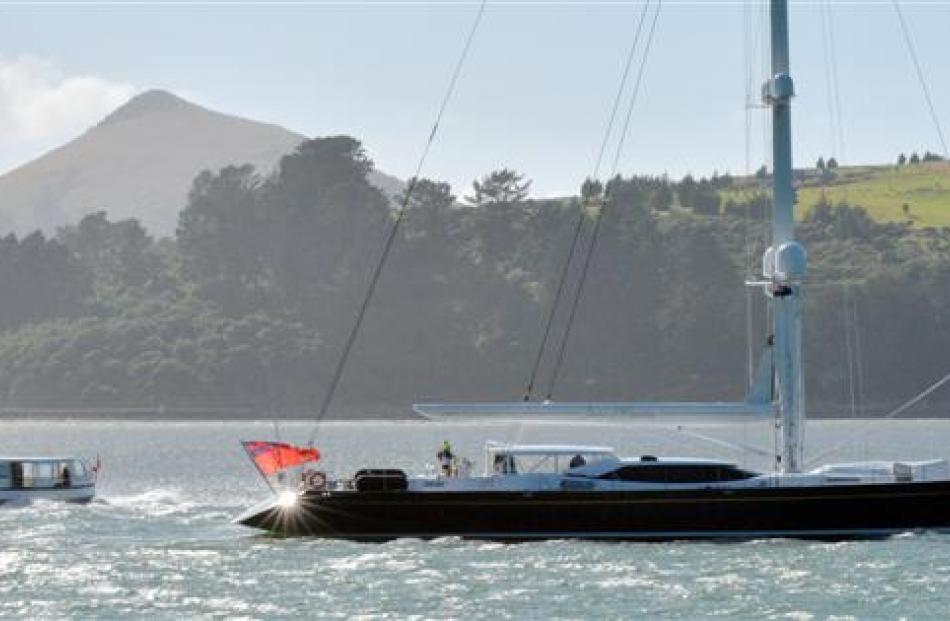 Super yacht Janice of Wyoming passes  Monarch on its way up Otago Harbour to Dunedin yesterday...