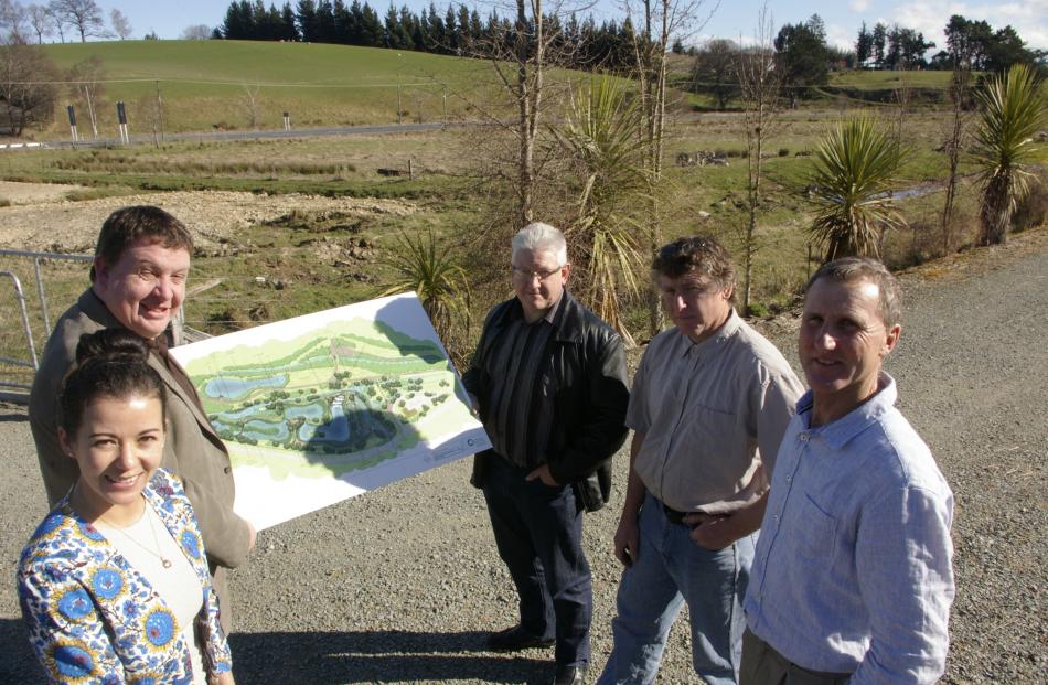 Supporters of a proposal to create wetlands to greet visitors to Lawrence are (from left) Lan...