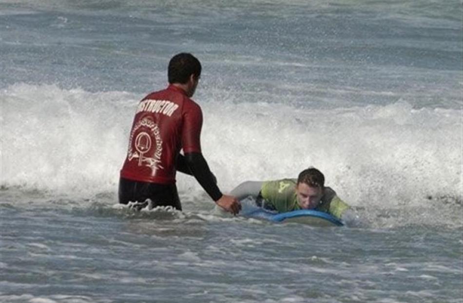 Surf's up for Hamish McNeilly at St Clair. Photos by Jane Dawber.