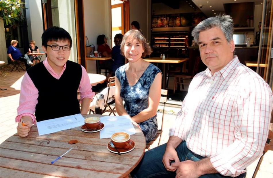 Survey principal investigator Seong Shin (left) discusses his survey findings with supervisors Dr...