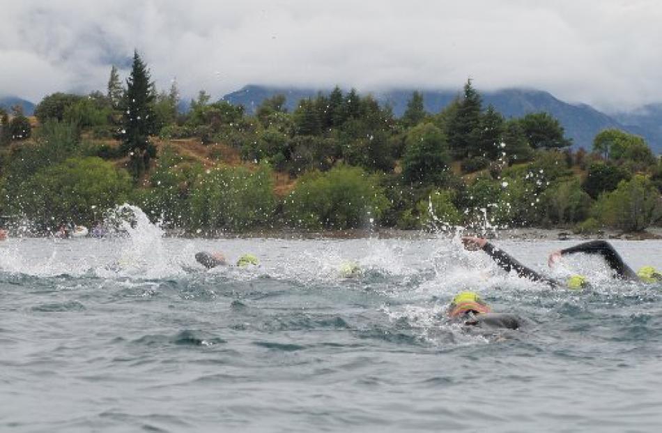 Swimmers in the 3.8km Big Ruby event head towards Ruby Island in Lake Wanaka, on Saturday.