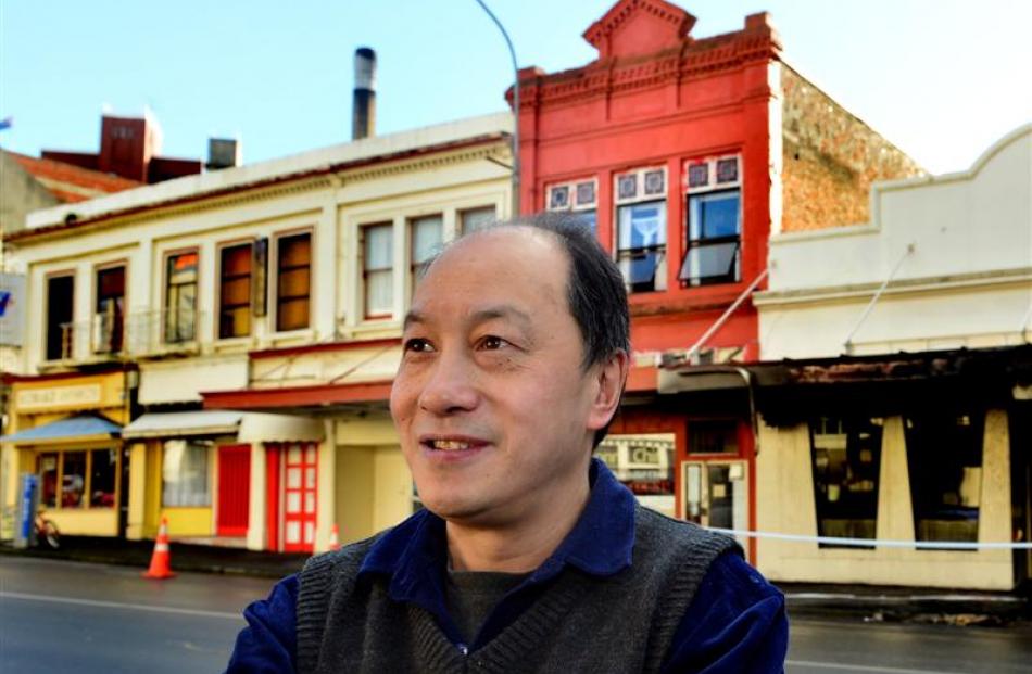 Tai Ping owner Henry Chin outside his fire-damaged restaurant yesterday. Photos by Peter McIntosh.