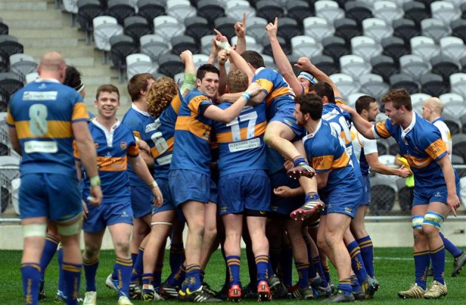 Taieri celebrates its win against University A in the Dunedin Premier rugby final in front of...