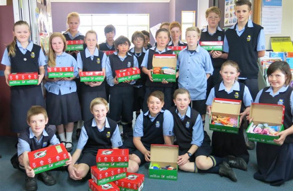 Taieri College room 7NJ pupils with their Operation Christmas Child donations.  Photo supplied.